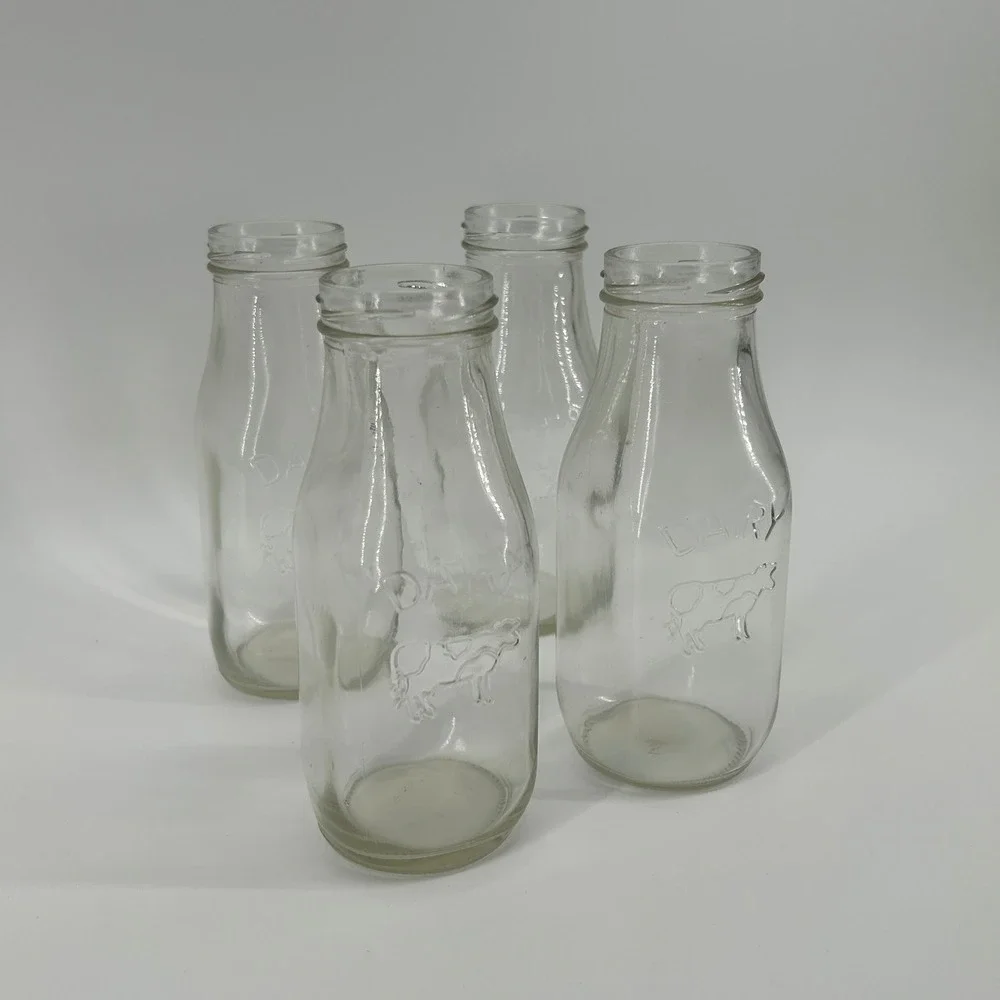 Set of 4 Vintage Style Glass Milk Bottles Embossed Cow Dairy Farmhouse Decor